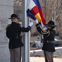 A Colorado State Patrol color guard raised the American and Colorado flags for the first time during a Jan. 14, 2013, celebration marking the opening of the Ralph L. Carr Colorado Judicial Center.