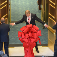 Chief Justice Michael L. Bender welcomes guests into the Court of Appeals courtroom on the first floor of the Ralph L. Carr Colorado Judicial Center after a ribbon-cutting ceremony on Jan. 14, 2013.